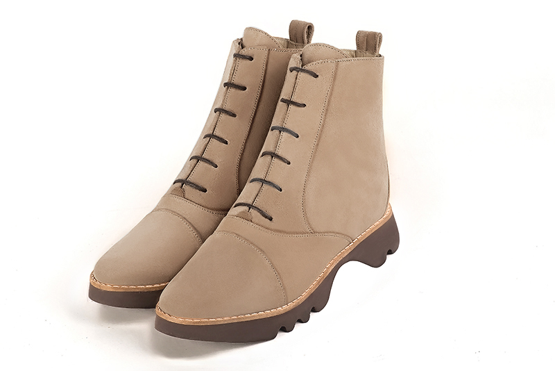 Tan beige women's ankle boots with laces at the front. Round toe. Flat rubber soles. Front view - Florence KOOIJMAN